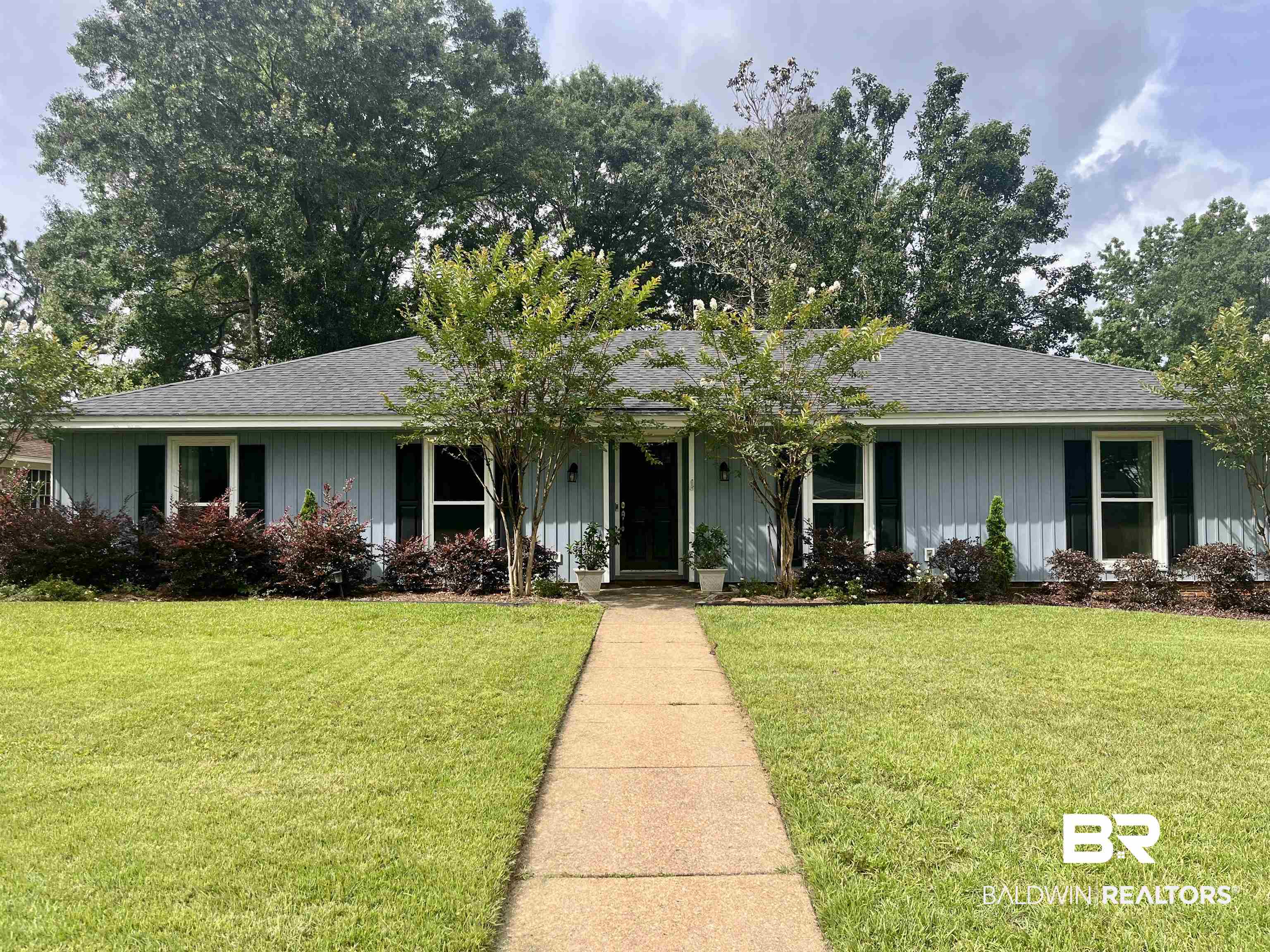 6429 Pinehurst Run Mobile, AL 36608 - Photo 1 of 15 Single-story residence featuring light blue vertical siding and a dark gray shingle roof