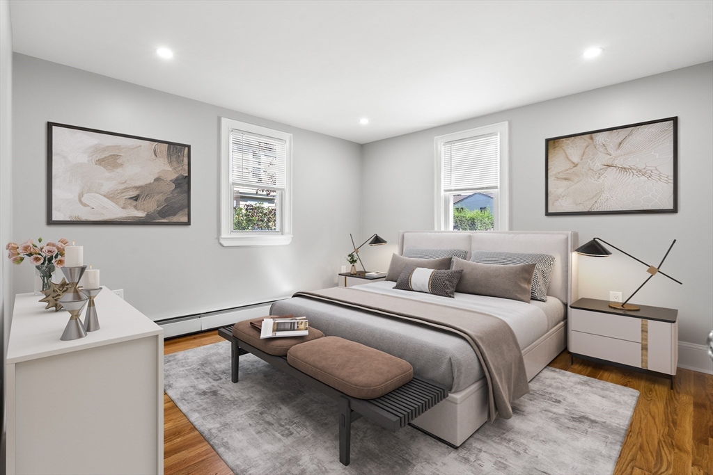 212 Cambridge Road Woburn, MA 01801 - Photo 14 of 25 a bedroom with a bed and a couch