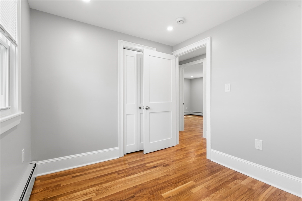 212 Cambridge Road Woburn, MA 01801 - Photo 19 of 25 a view of empty room with wooden floor