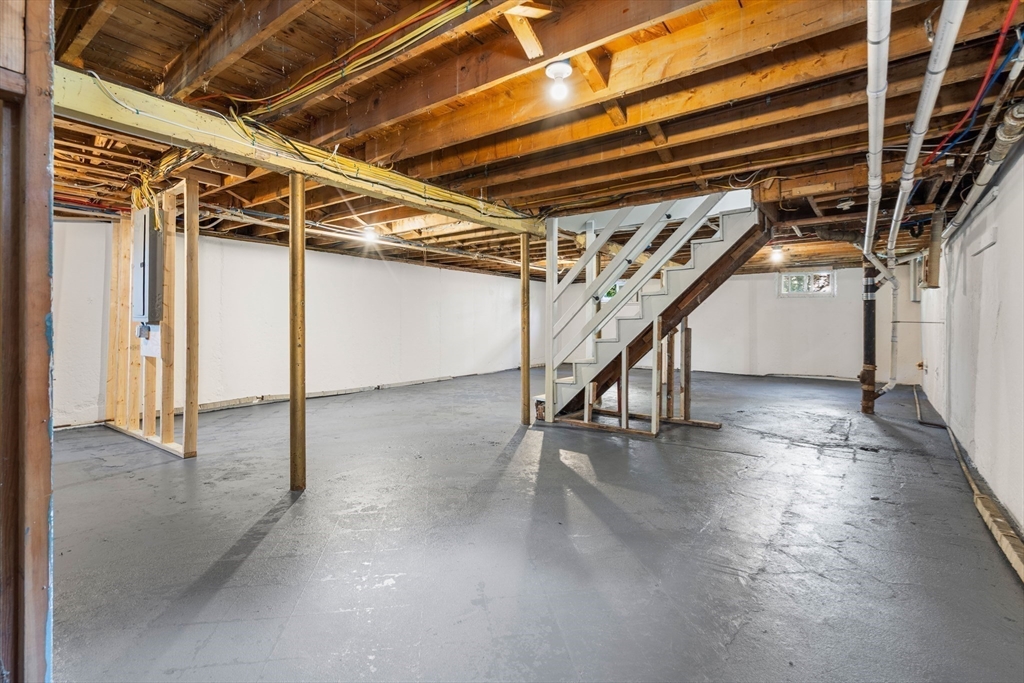 212 Cambridge Road Woburn, MA 01801 - Photo 23 of 25 a view of an empty room with wooden floor