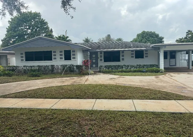a house view with a backyard space