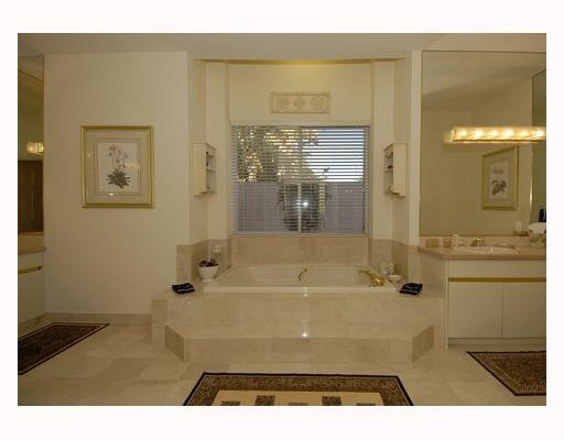 2855 Paddock Road Weston, FL 33331 - Photo 12 of 16 a bathroom with a tub shower and sink