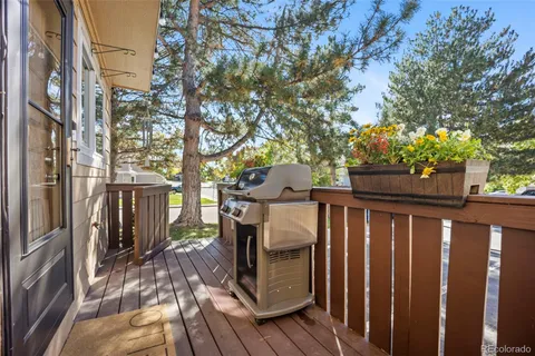 a view of a deck with wooden floor and fence