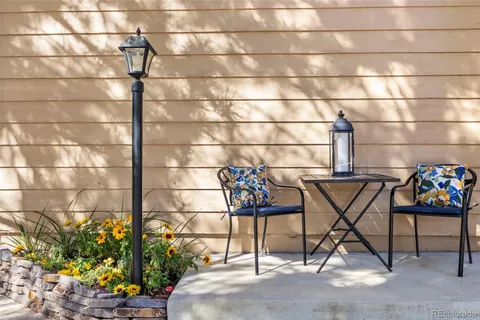 a couple of table chair and potted plant