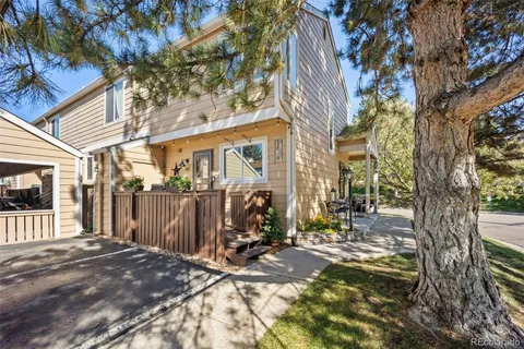 a view of a house with a tree