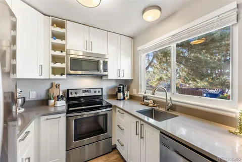 a bedroom with a bed and a lamp