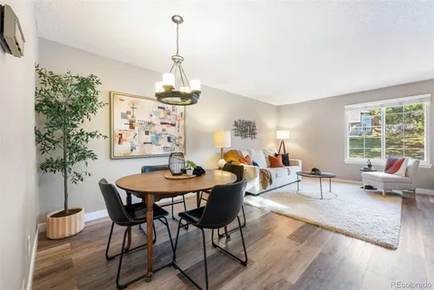 a view of a dining room with furniture window and wooden floor