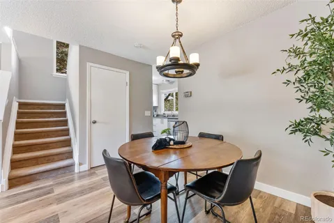 a dining room with a table and chairs