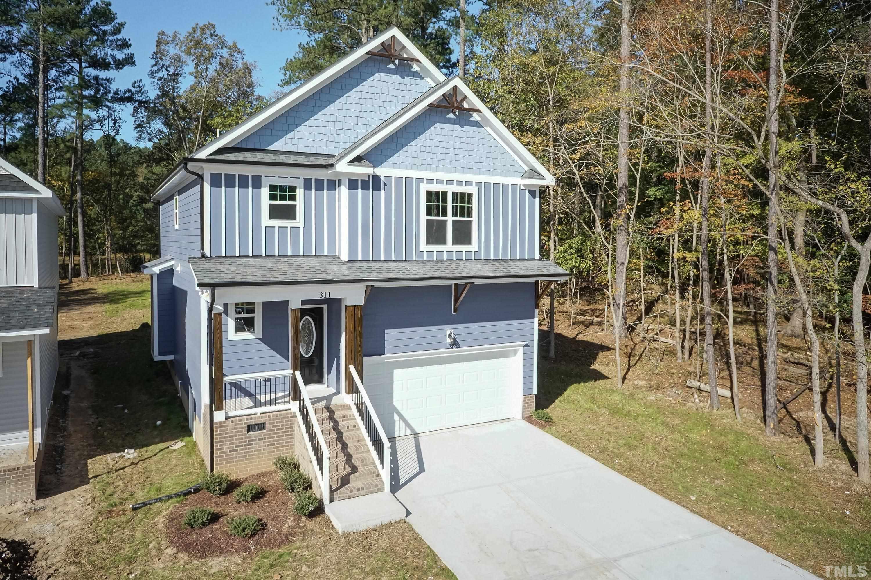 6002 East Pool Road Rougemont, NC 27572 - Photo 1 of 23 a front view of a house with a yard