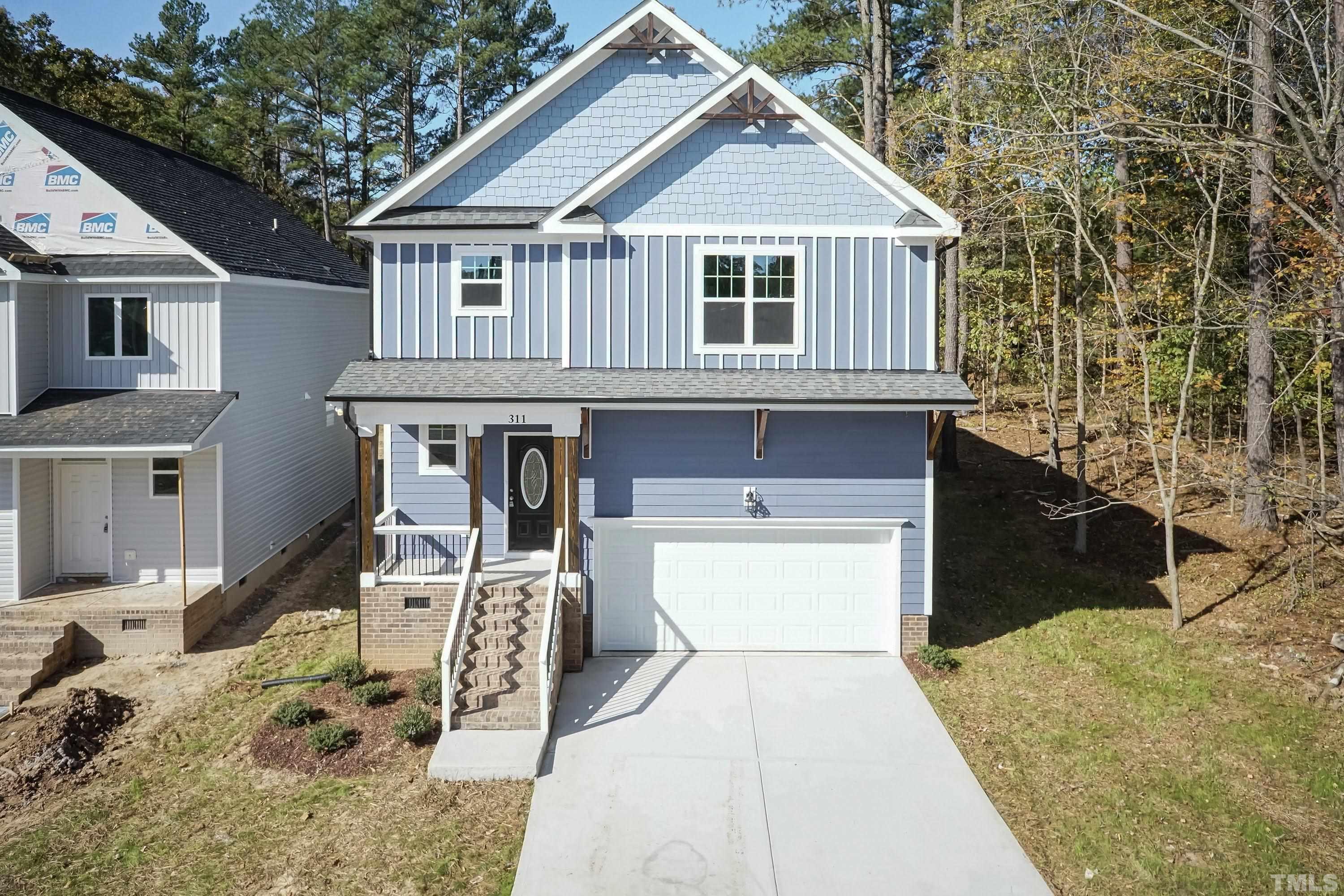 6002 East Pool Road Rougemont, NC 27572 - Photo 2 of 23 a front view of a house with garden