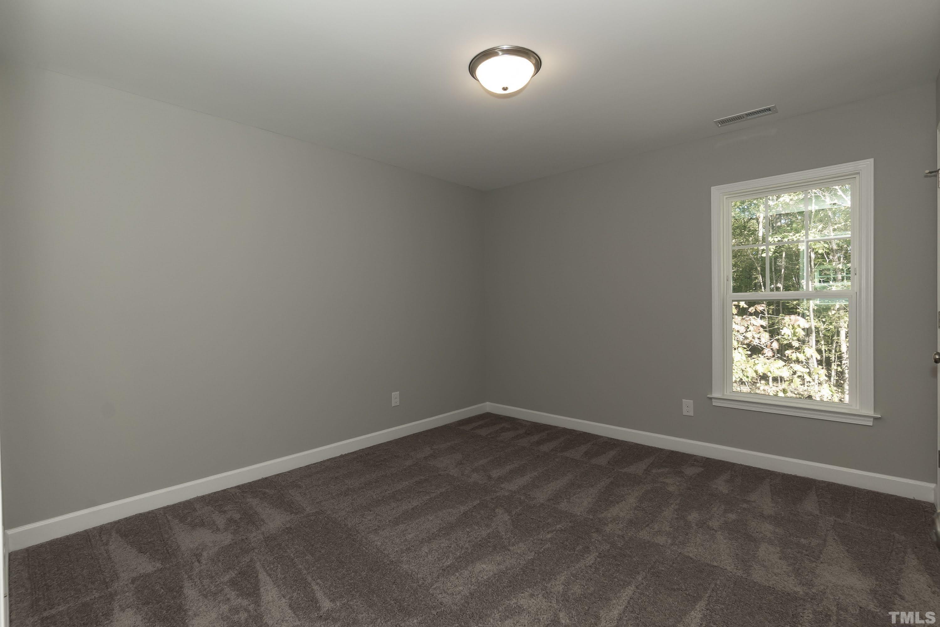 6002 East Pool Road Rougemont, NC 27572 - Photo 21 of 23 an empty room with a window
