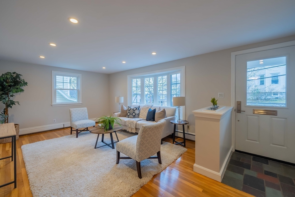 55 Sutherland Road, Unit 55 Arlington, MA 02476 - Photo 3 of 23 a living room with furniture and a window