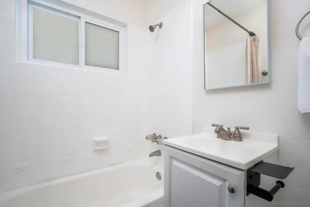 a bathroom with a sink and a bathtub
