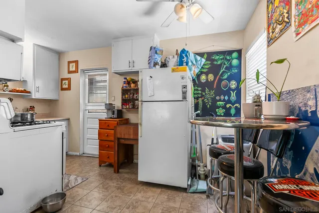 a white refrigerator freezer sitting in a kitchen