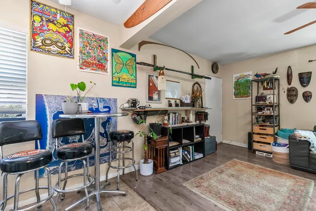 a view of a workspace with furniture and toys