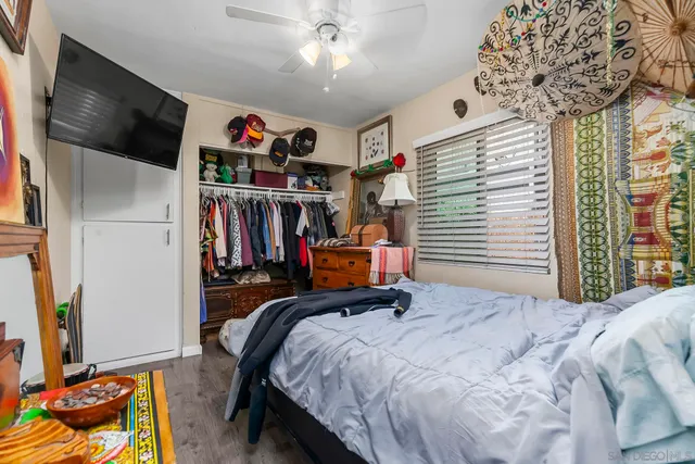 a bed room with a bed and a flat screen tv