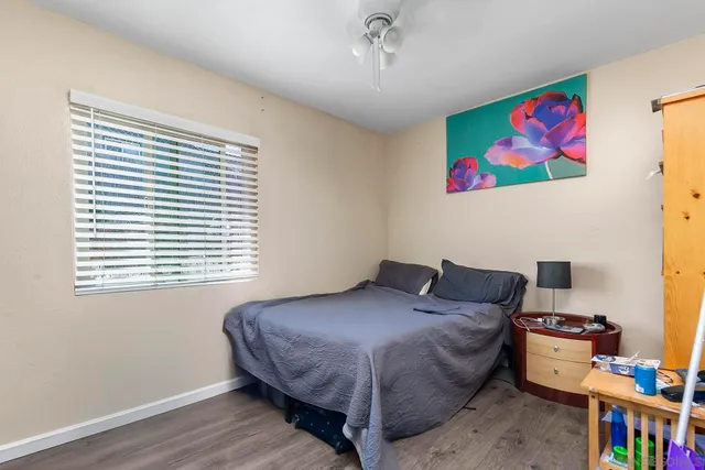 a bedroom with a bed and a book shelf