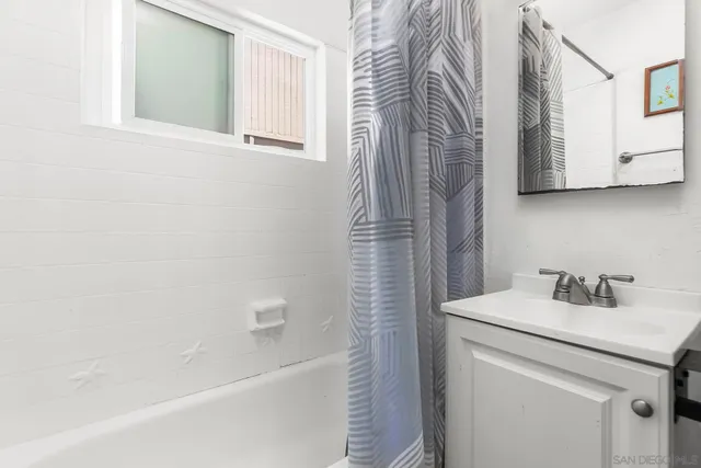 a bathroom with a sink a toilet and a bathtub