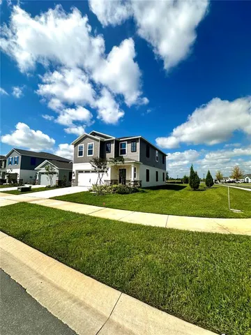 a view of house with garden