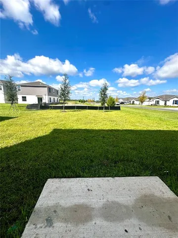 a view of an swimming pool and an outdoor space