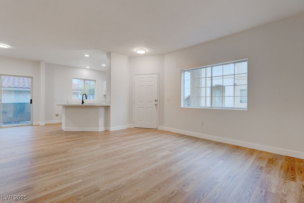 1881 West Alexander Road, Unit 1129 North Las Vegas, NV 89032 - Photo 12 of 31 Living room with light wood-style flooring and recessed lighting