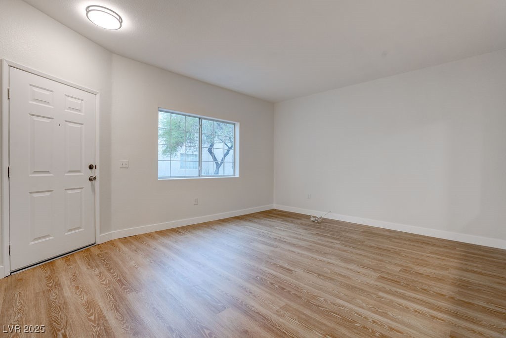 1881 West Alexander Road, Unit 1129 North Las Vegas, NV 89032 - Photo 13 of 31 Foyer entrance featuring light wood finished floors and baseboards