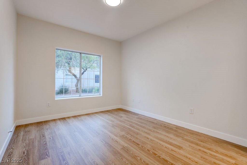 1881 West Alexander Road, Unit 1129 North Las Vegas, NV 89032 - Photo 21 of 31 Empty room featuring light wood-type flooring and baseboards