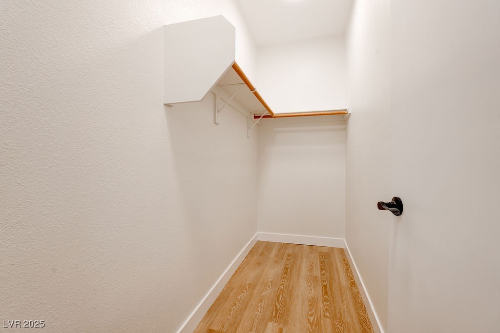 1881 West Alexander Road, Unit 1129 North Las Vegas, NV 89032 - Photo 24 of 31 Walk in closet featuring light wood finished floors