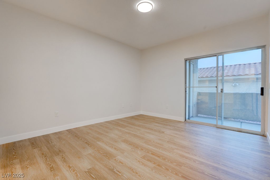 1881 West Alexander Road, Unit 1129 North Las Vegas, NV 89032 - Photo 5 of 31 Dining room featuring light wood-style flooring and baseboards