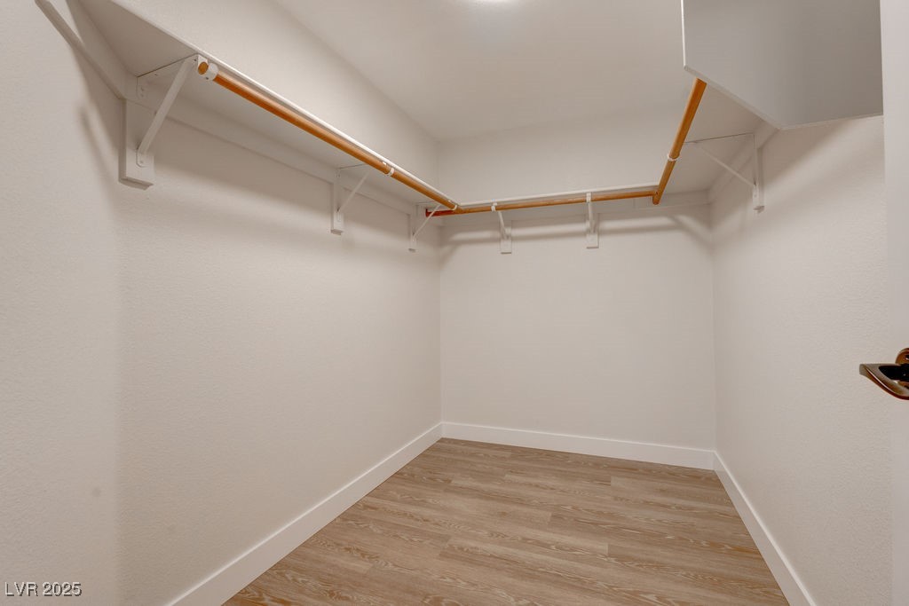 1881 West Alexander Road, Unit 1129 North Las Vegas, NV 89032 - Photo 8 of 31 Walk in closet with light wood-style floors