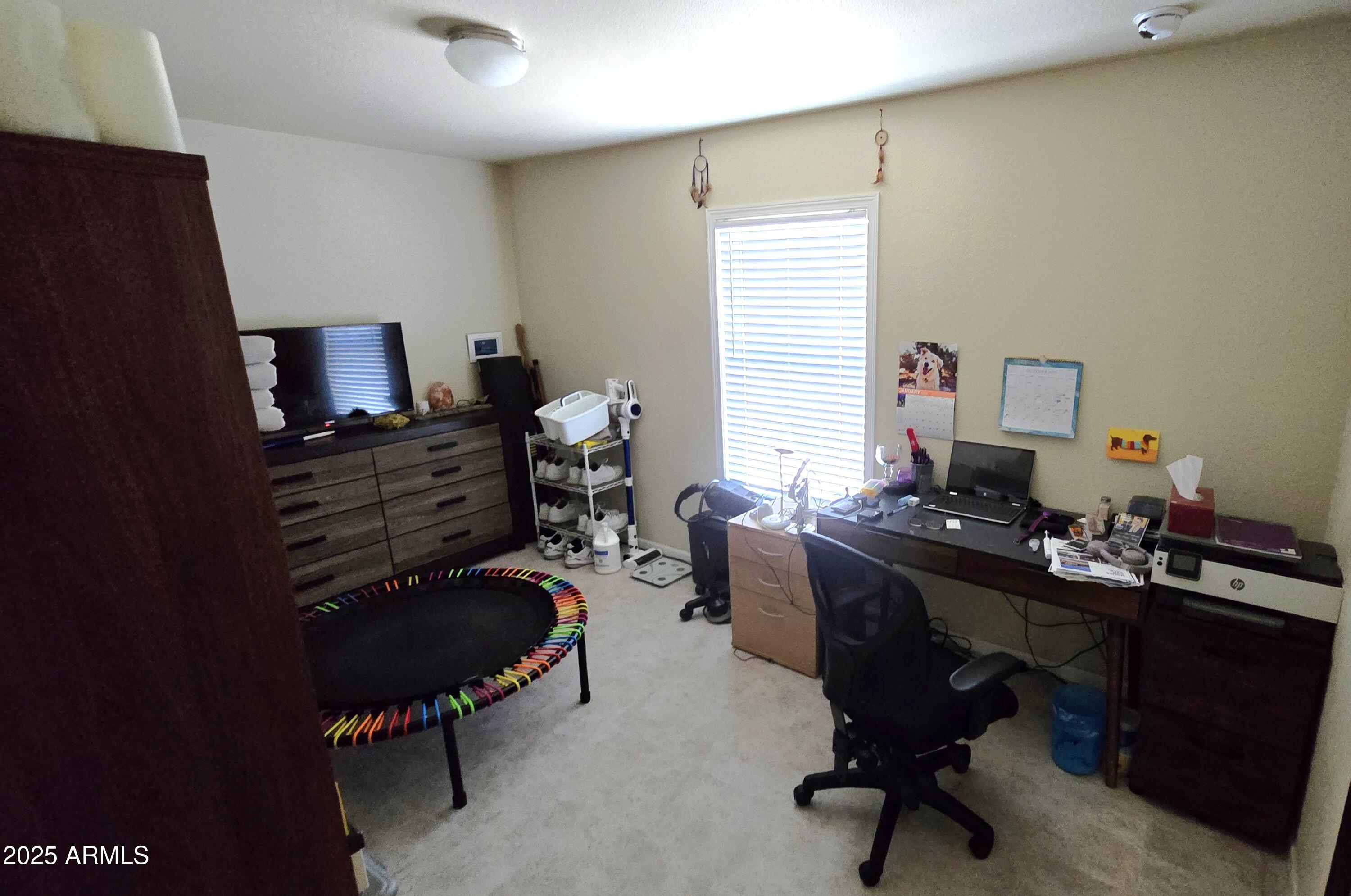 10540 East Apache Trail, Unit 182 Apache Junction, AZ 85120 - Photo 13 of 30 a view of a workspace with furniture and a window