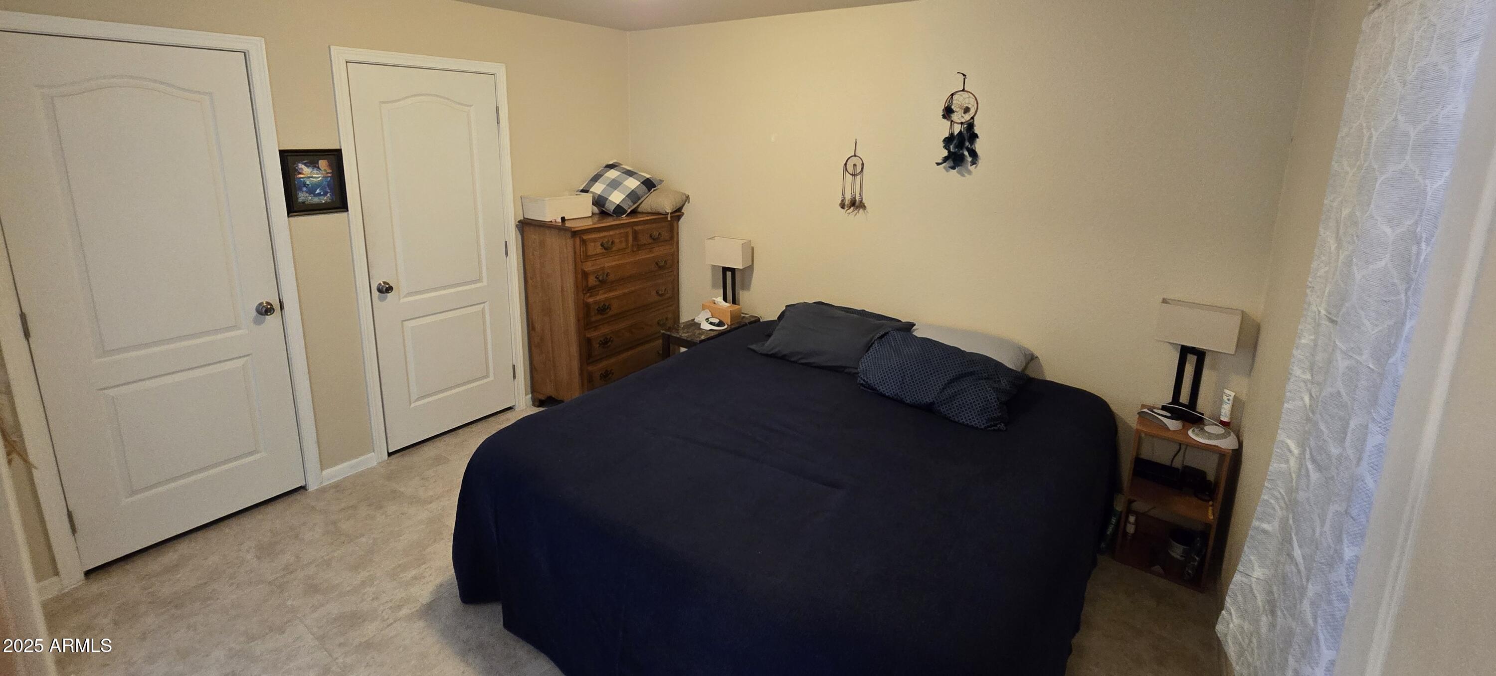 10540 East Apache Trail, Unit 182 Apache Junction, AZ 85120 - Photo 23 of 30 a bedroom with a bed and a dresser