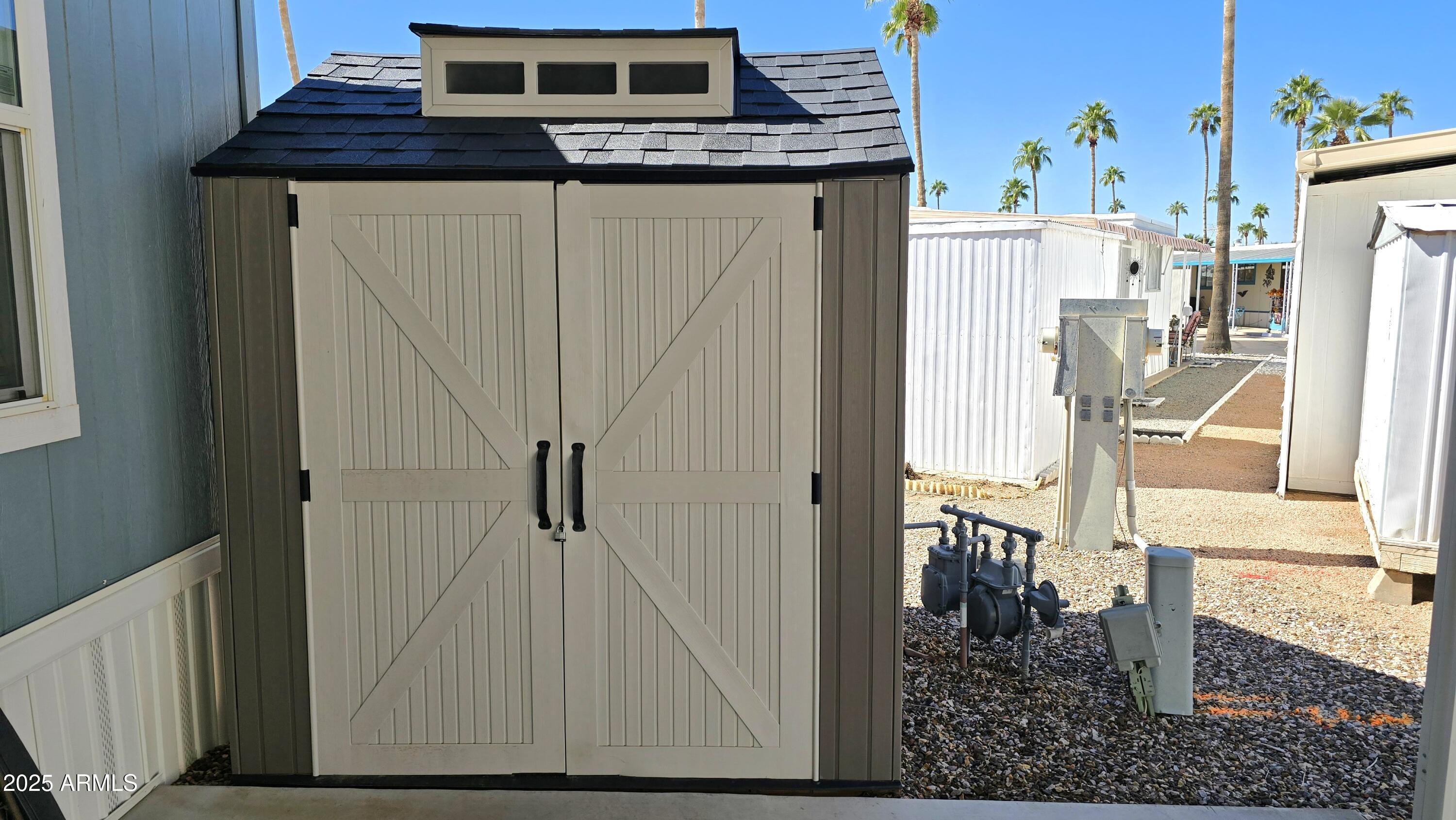 10540 East Apache Trail, Unit 182 Apache Junction, AZ 85120 - Photo 9 of 30 a view of a hallway with wooden floor and staircase