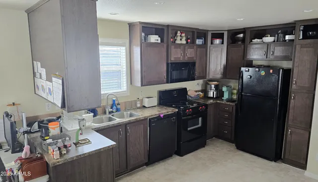 a kitchen with a sink stove and refrigerator