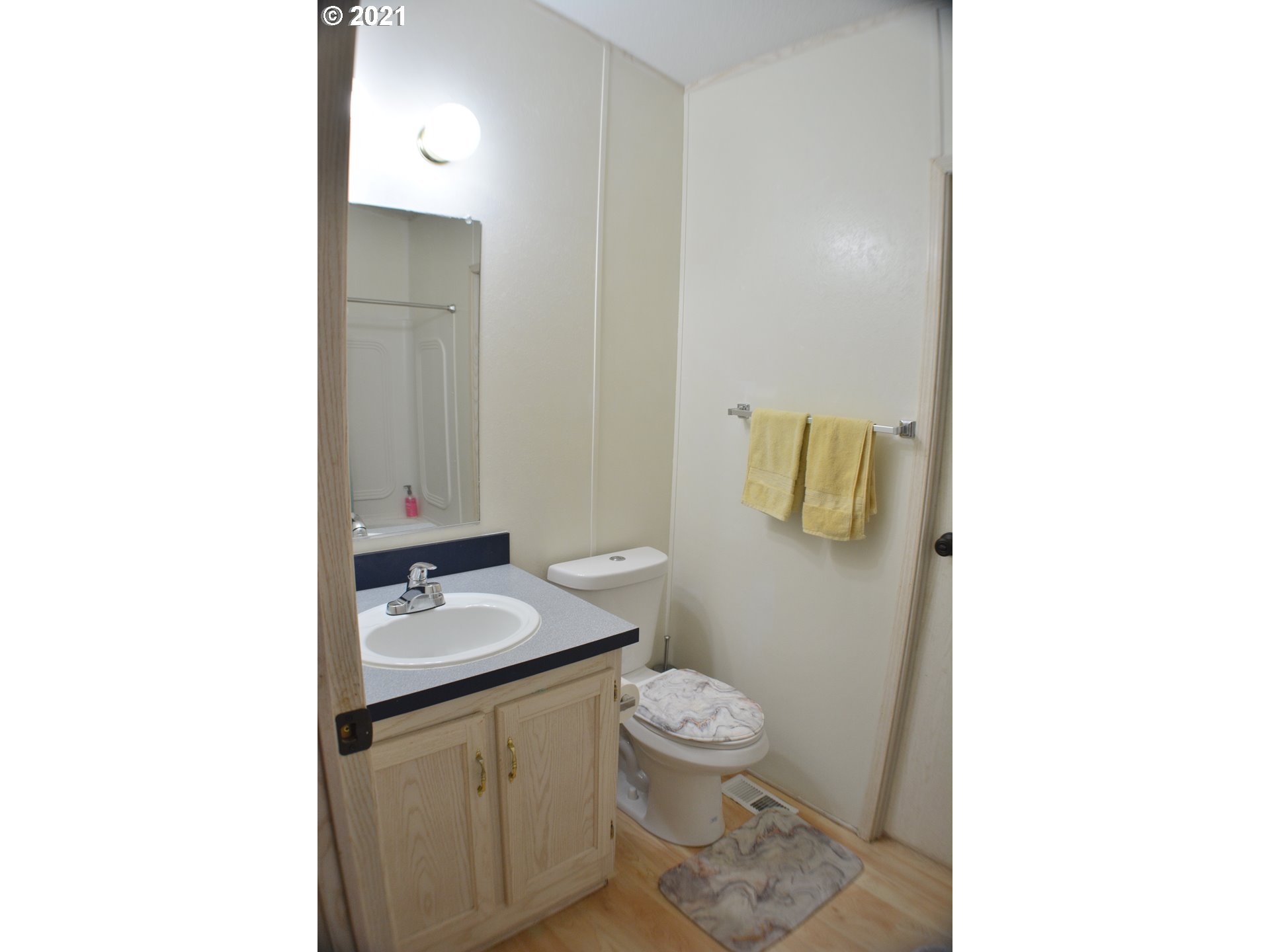 57915 Highway 203 Union, OR 97883 - Photo 14 of 27 a bathroom with a granite countertop toilet and sink