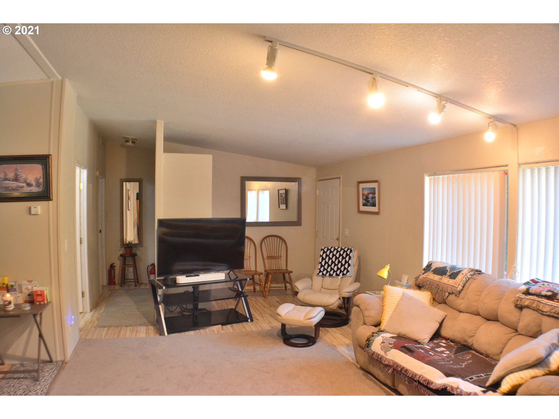 57915 Highway 203 Union, OR 97883 - Photo 5 of 27 a living room with furniture a window and a flat screen tv