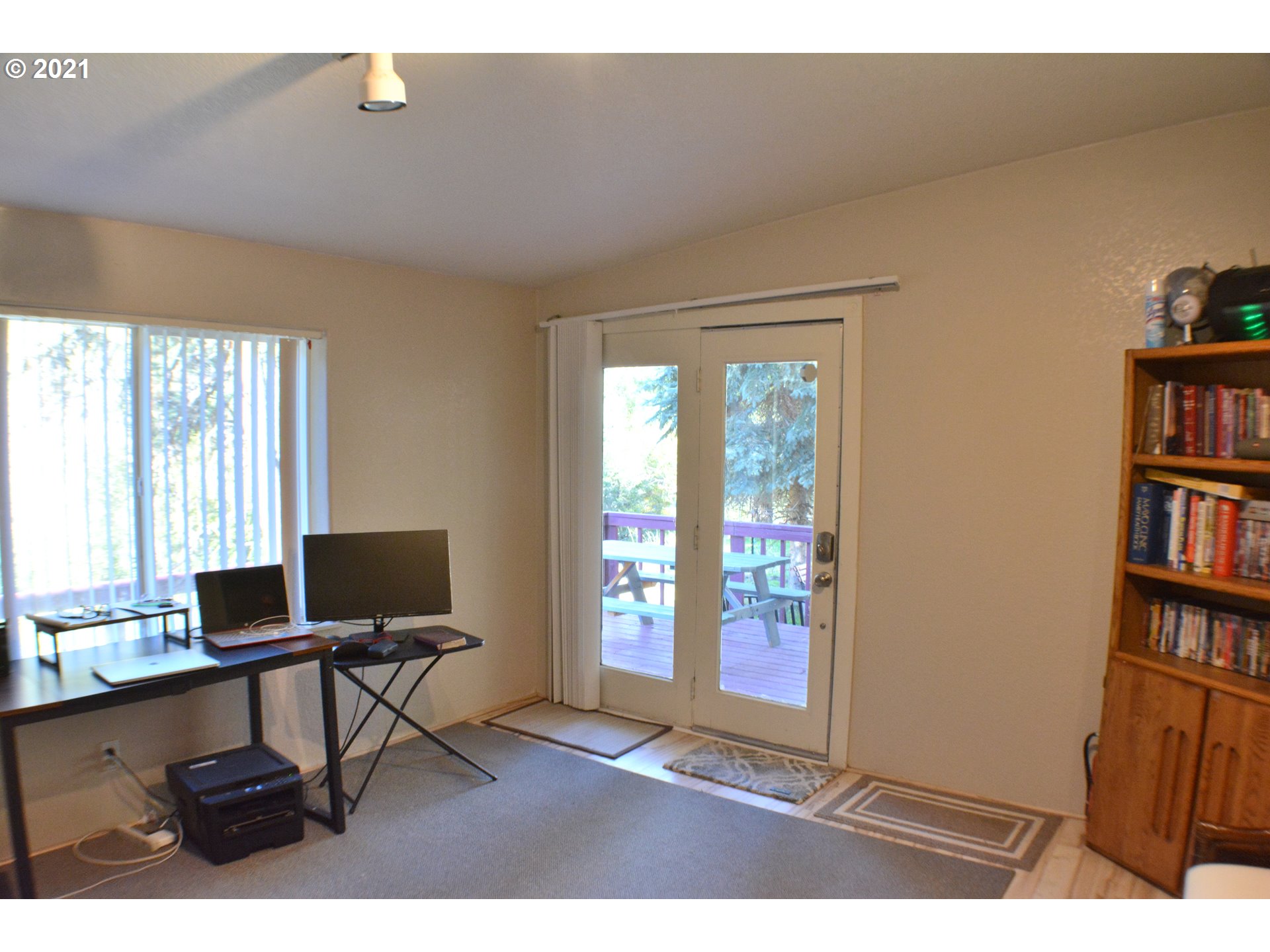 57915 Highway 203 Union, OR 97883 - Photo 8 of 27 a living room with furniture a bookshelf and a window
