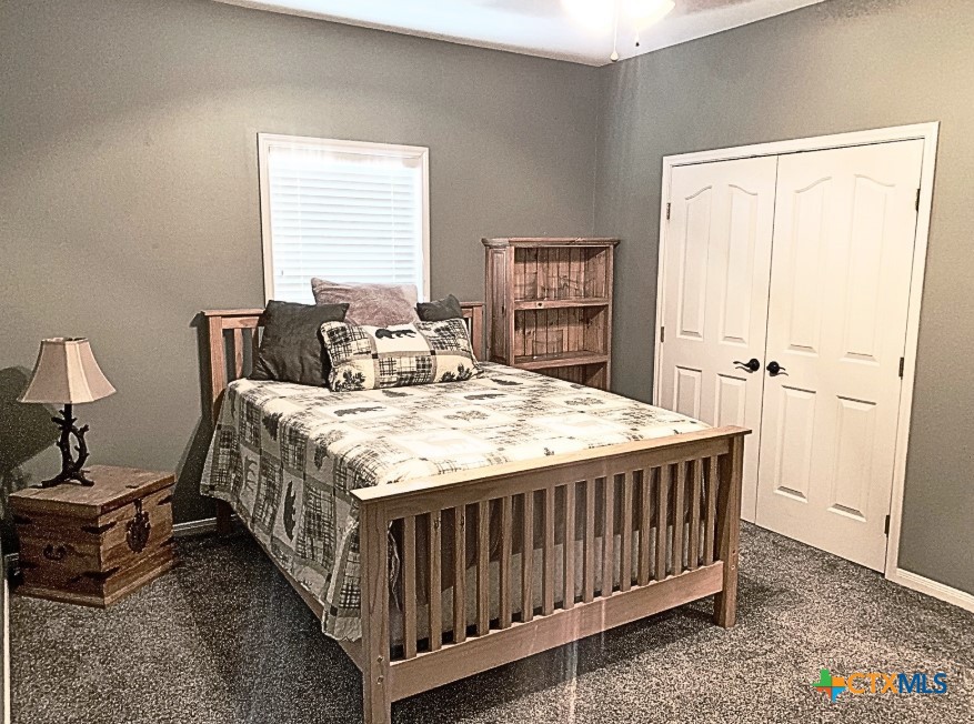 949 Abrameit Road Goliad, TX 77963 - Photo 18 of 30 a bedroom with a bed and a table