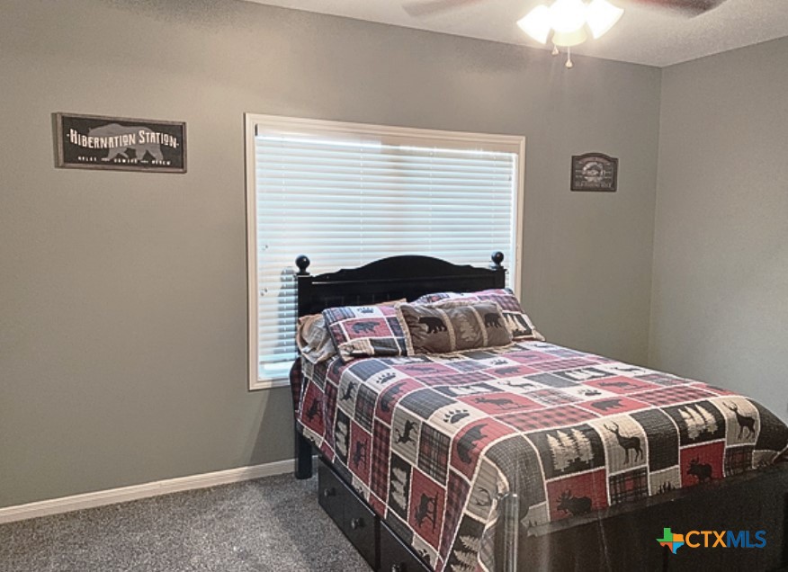 949 Abrameit Road Goliad, TX 77963 - Photo 19 of 30 a bedroom with a bed and a window