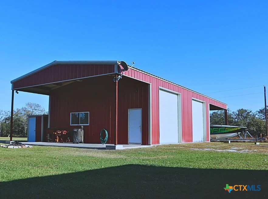 949 Abrameit Road Goliad, TX 77963 - Photo 22 of 30 a front view of a house with a garden