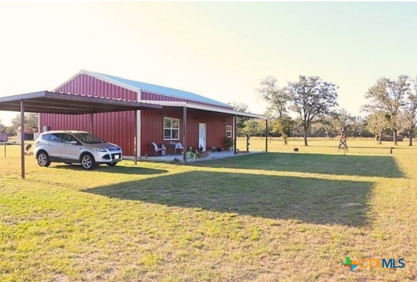 949 Abrameit Road Goliad, TX 77963 - Photo 24 of 30 a front view of house with yard and trees