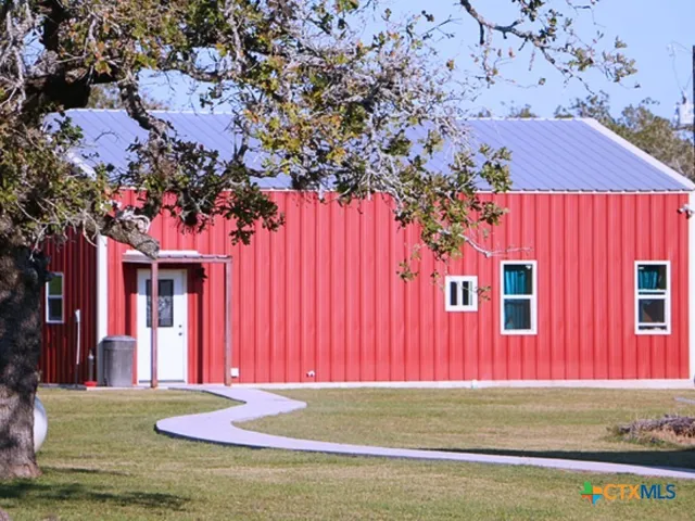 a view of a house with a tree