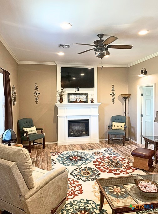 949 Abrameit Road Goliad, TX 77963 - Photo 30 of 30 a living room with furniture a flat screen tv and a fireplace
