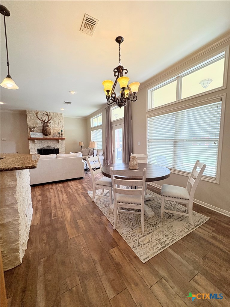 949 Abrameit Road Goliad, TX 77963 - Photo 34 of 48 a living room with furniture a chandelier and a window