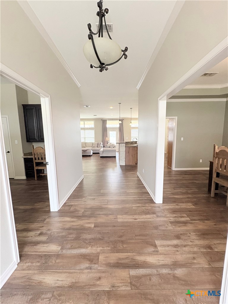 949 Abrameit Road Goliad, TX 77963 - Photo 35 of 48 a view hallway space with wooden floor and ceiling fan