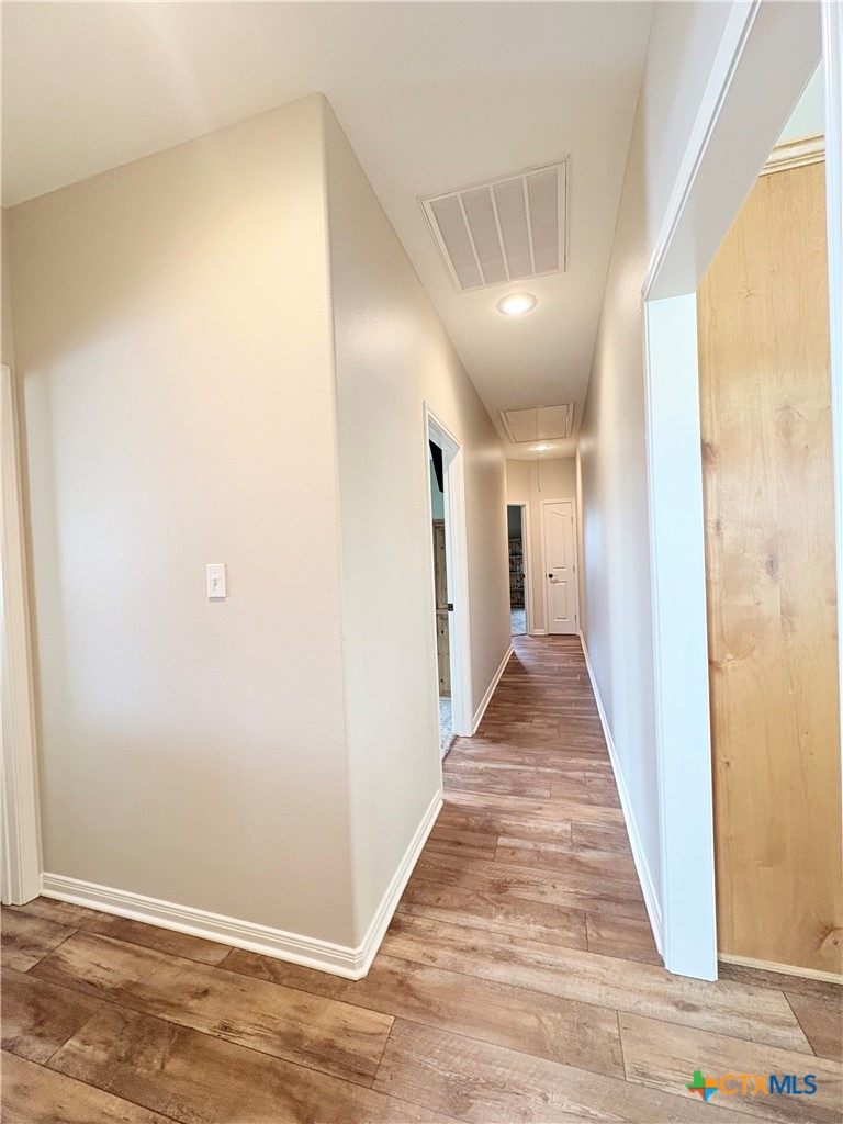 949 Abrameit Road Goliad, TX 77963 - Photo 38 of 48 a view of a hallway with wooden floor
