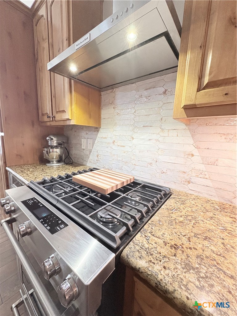 949 Abrameit Road Goliad, TX 77963 - Photo 40 of 48 a stove top oven sitting inside of a kitchen