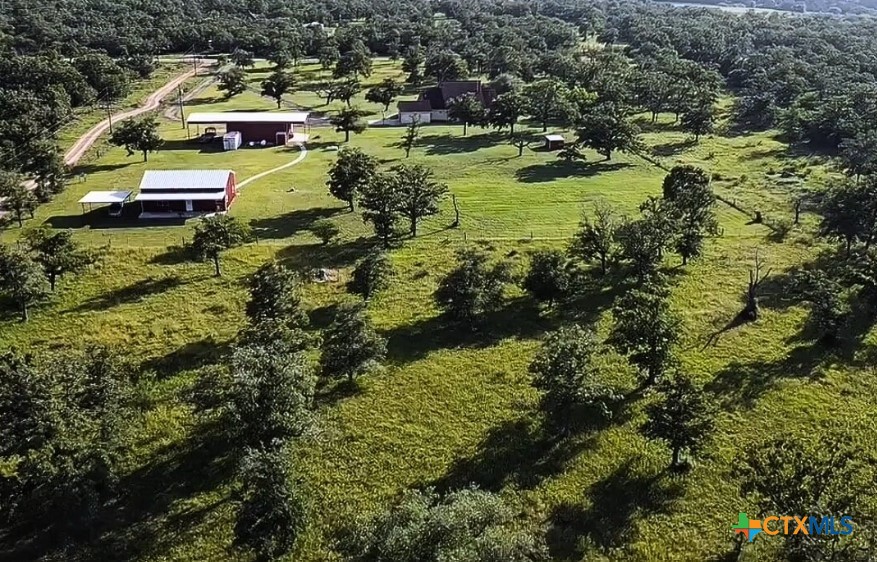 949 Abrameit Road Goliad, TX 77963 - Photo 4 of 30 a aerial view of residential house with outdoor space and swimming pool
