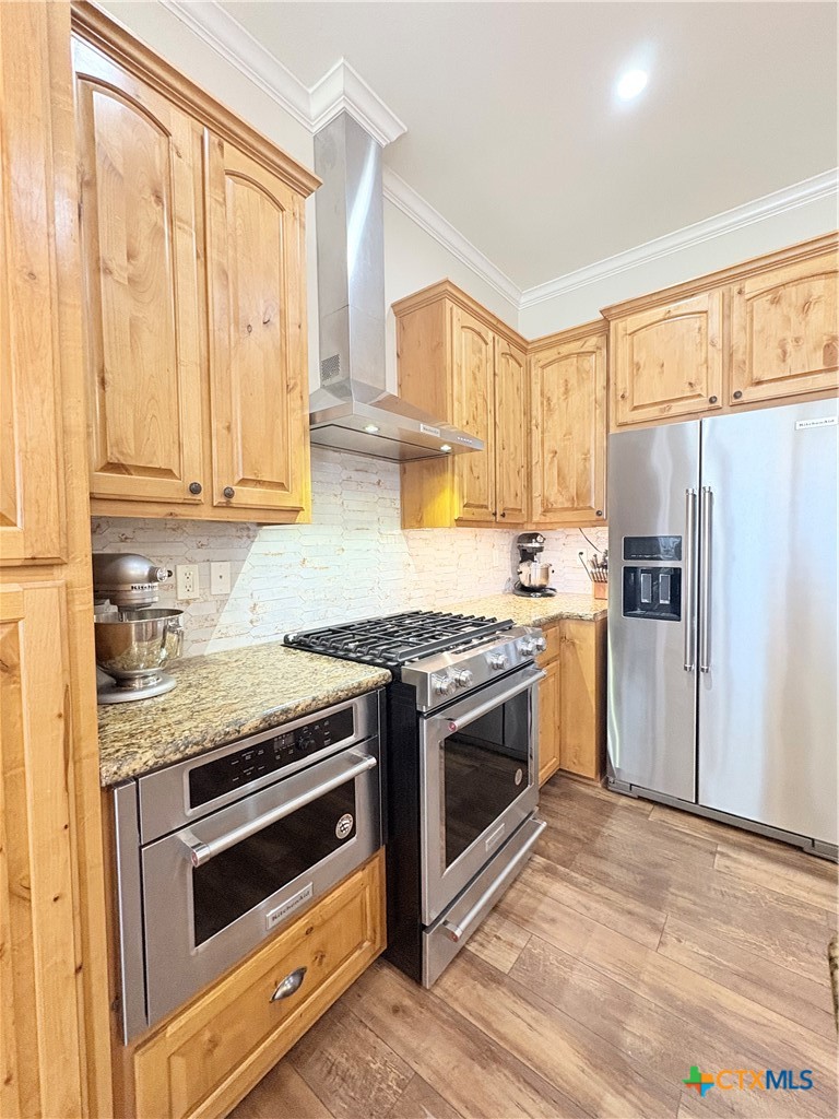 949 Abrameit Road Goliad, TX 77963 - Photo 44 of 48 a kitchen with a stove a sink and a refrigerator