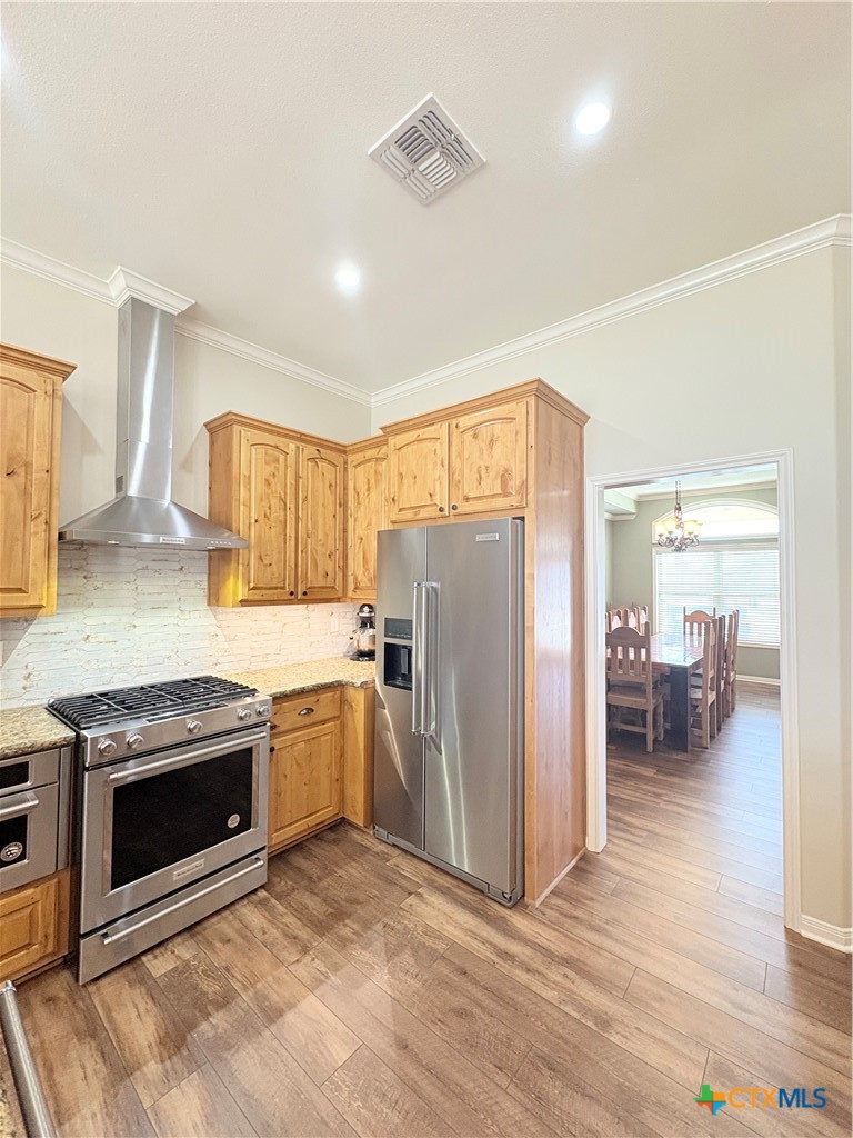 949 Abrameit Road Goliad, TX 77963 - Photo 46 of 48 a kitchen with a stove a refrigerator and a sink